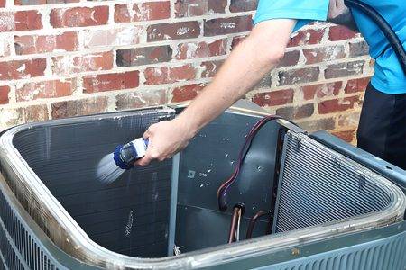 technician works on AC Maintenance Irvington