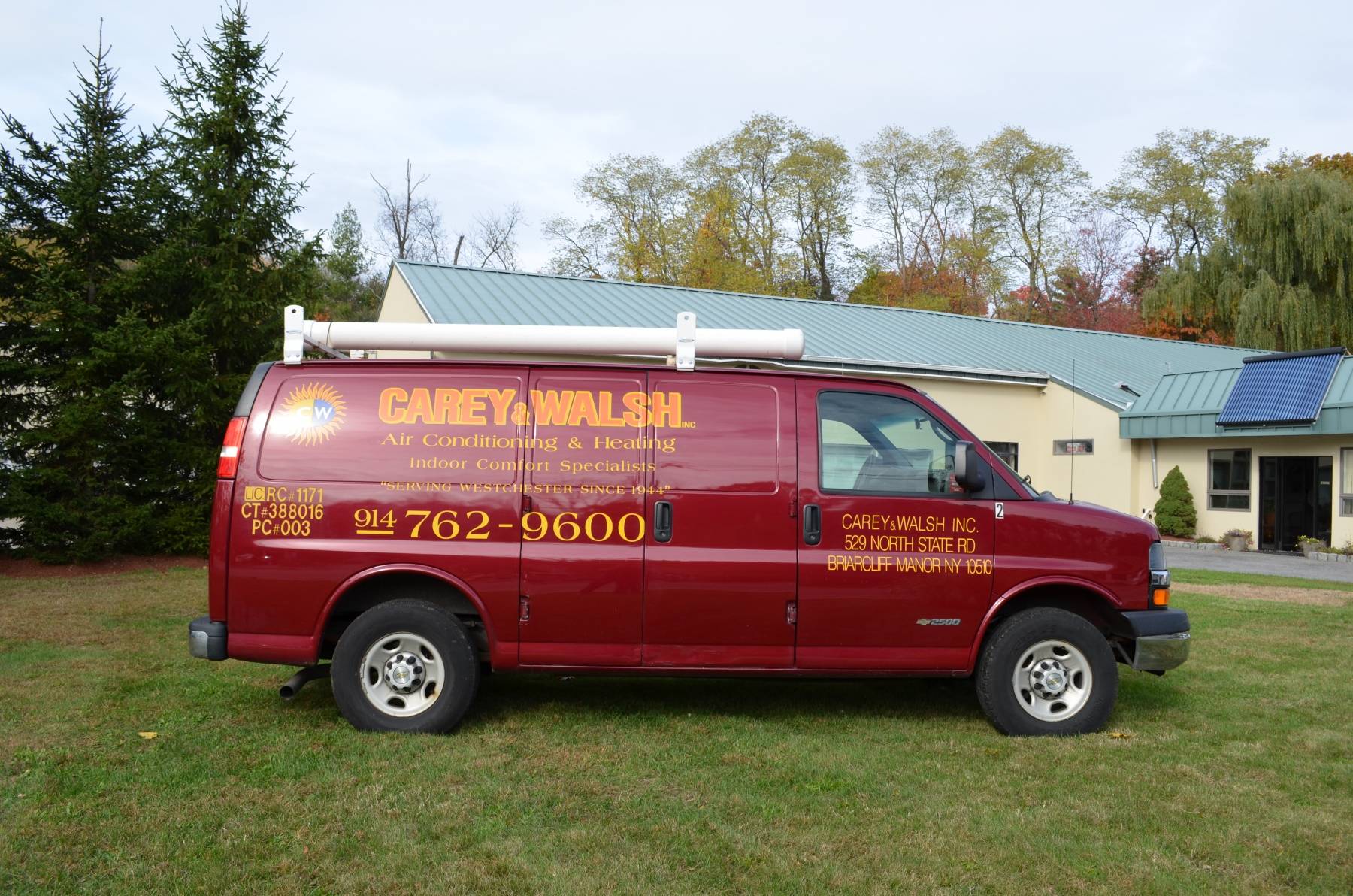 carey&walsh red service van in front of the office
