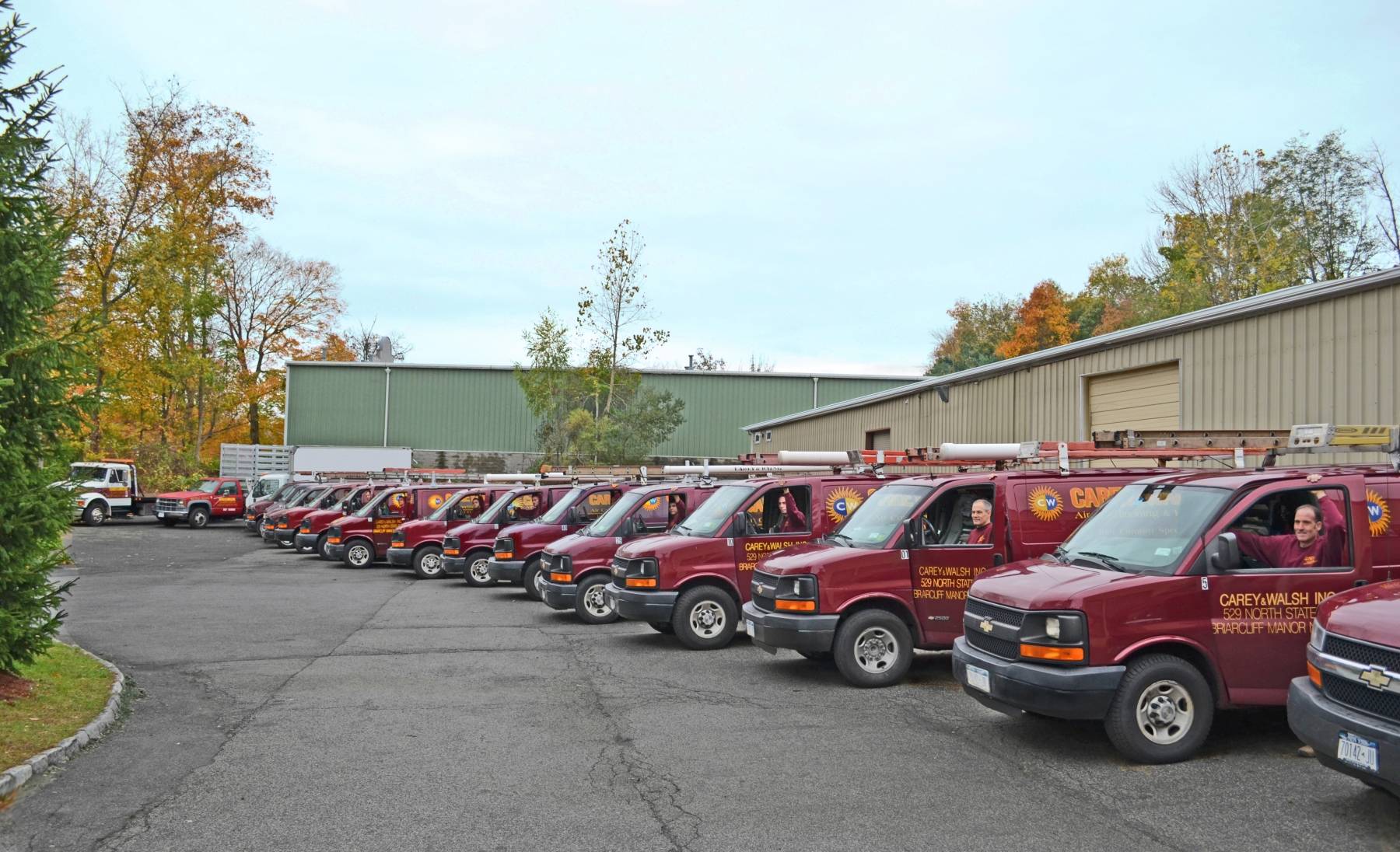 carey&walsh red service vans parking in front of the warehouse